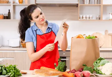 Woman checking grocery list
